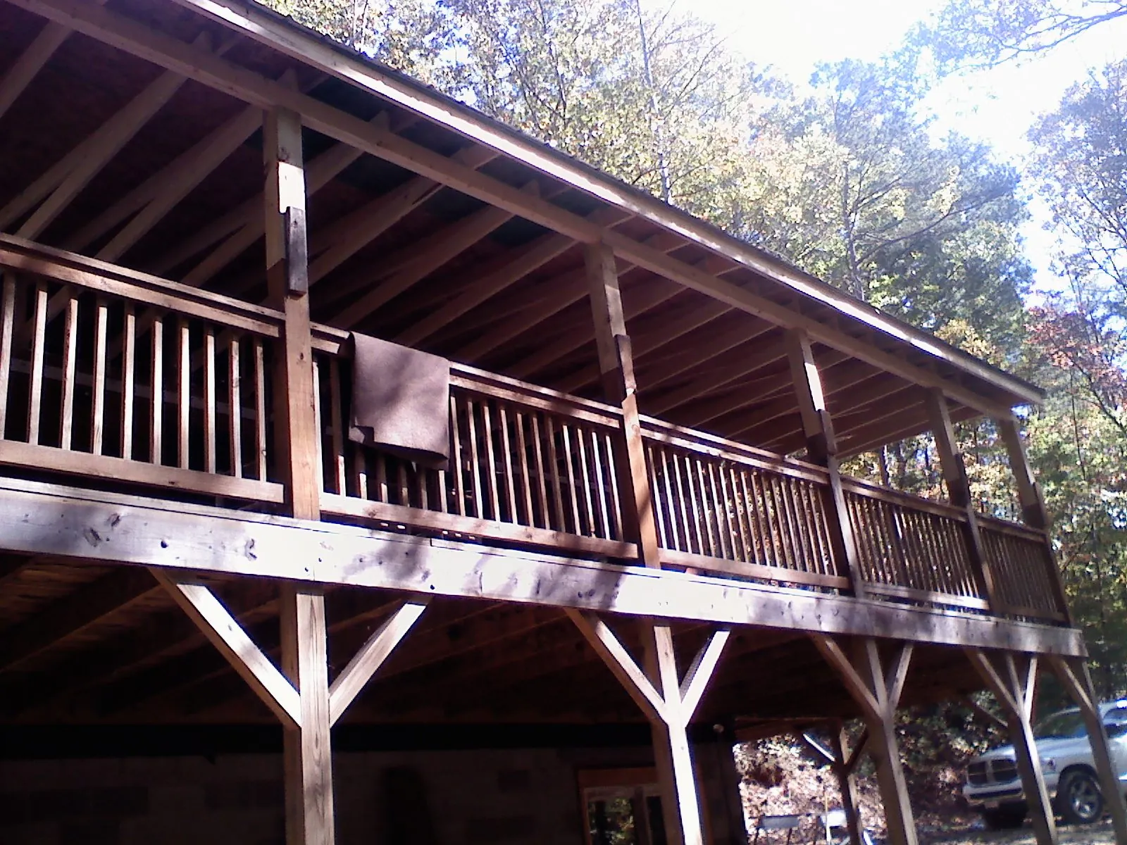 Timber framing under a new elevated porch and deck — Roof Leak Repair in Leverett by Roofing Brothers